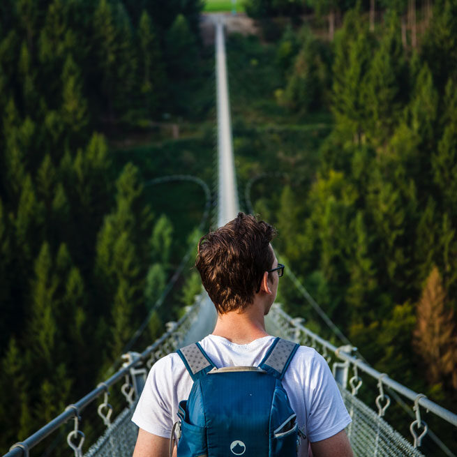 Person crossing bridge